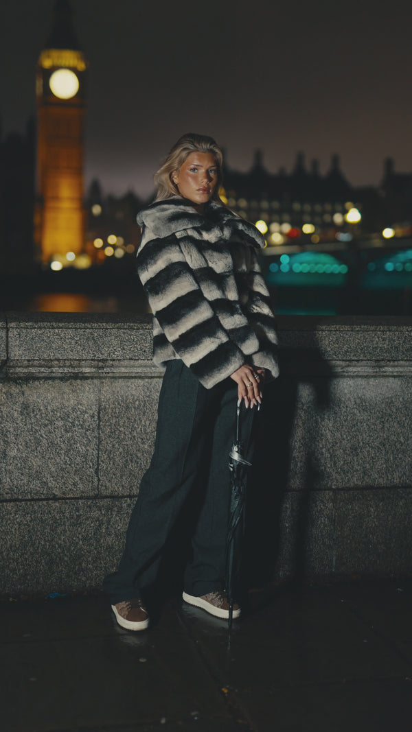 Elizabeth rex rabbit fur coat in frosted silver, worn by the Thames at night